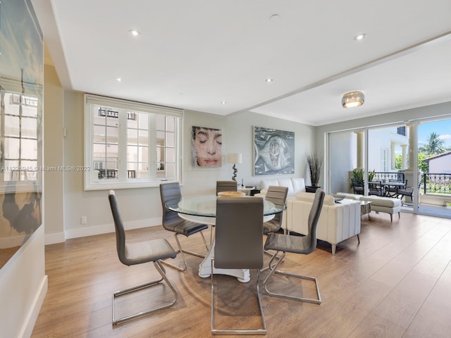 dining area featuring light wood-type flooring