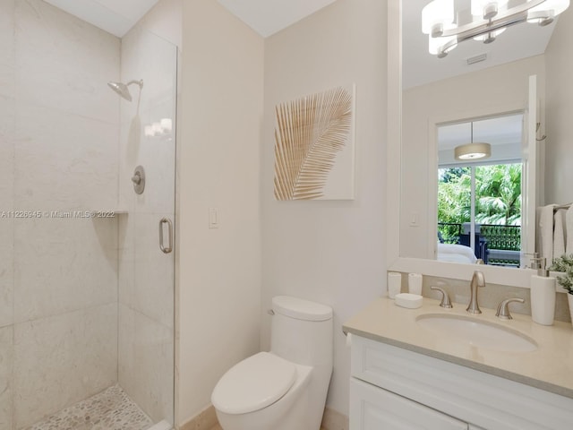 bathroom with an enclosed shower, toilet, and vanity