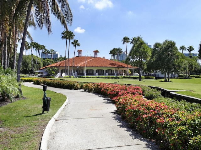 view of property's community with a lawn