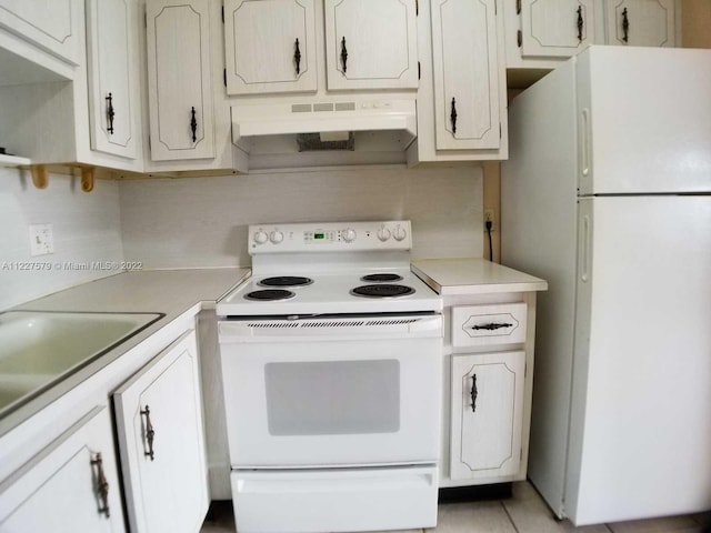 kitchen featuring wall chimney exhaust hood, white appliances, and white cabinetry