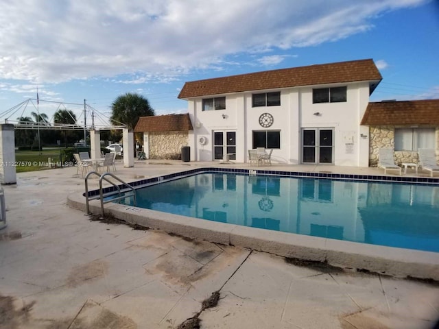 view of swimming pool featuring a patio area