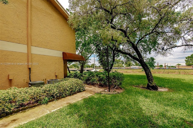 view of yard with central AC