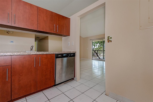 kitchen featuring light tile floors and dishwasher