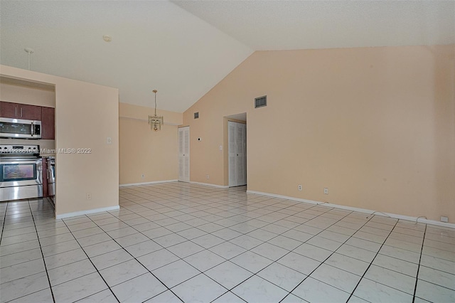 spare room featuring a notable chandelier, light tile floors, and high vaulted ceiling