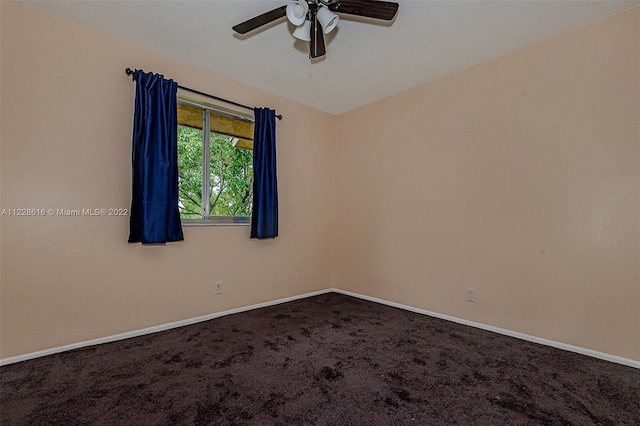 empty room featuring carpet and ceiling fan