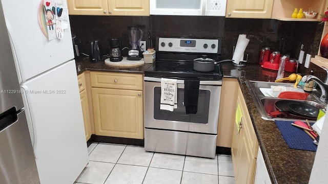 3401 N Country Club Dr Unit 406, Aventura, FL 33180 - kitchen with white appliances, light tile patterned floors, and dark stone countertops