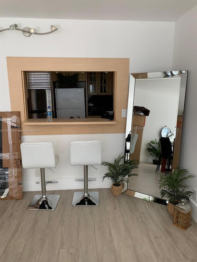 3401 N Country Club Dr Unit 406, Aventura, FL 33180 - bar featuring freestanding refrigerator, wood finished floors, and refrigerator