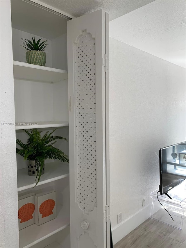 3401 N Country Club Dr Unit 406, Aventura, FL 33180 - detailed view of wood finished floors and baseboards