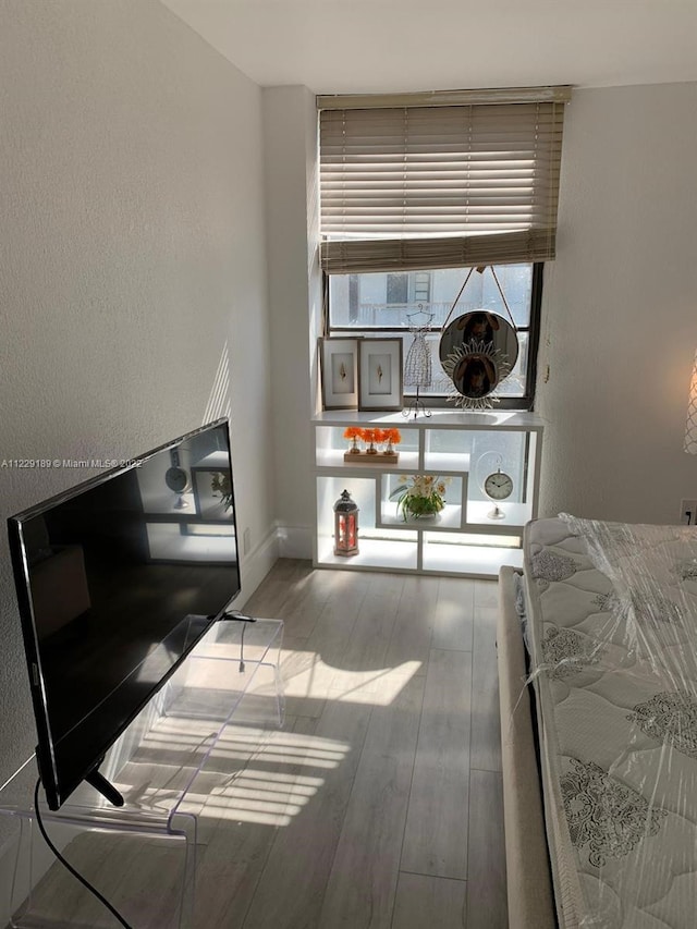 3401 N Country Club Dr Unit 406, Aventura, FL 33180 - bedroom with wood finished floors and baseboards