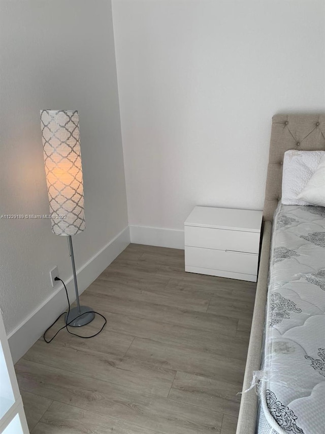3401 N Country Club Dr Unit 406, Aventura, FL 33180 - unfurnished bedroom featuring baseboards and light wood-style floors