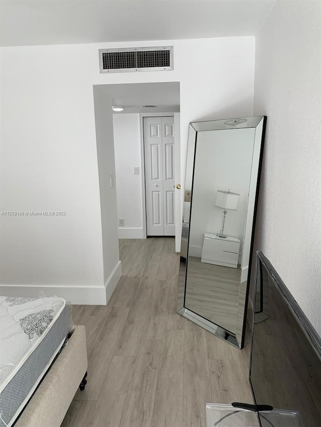 3401 N Country Club Dr Unit 406, Aventura, FL 33180 - bedroom with light wood-style flooring and a closet