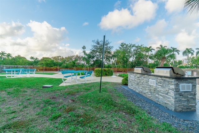 3401 N Country Club Dr Unit 406, Aventura, FL 33180 - view of yard featuring an outdoor kitchen and a patio area