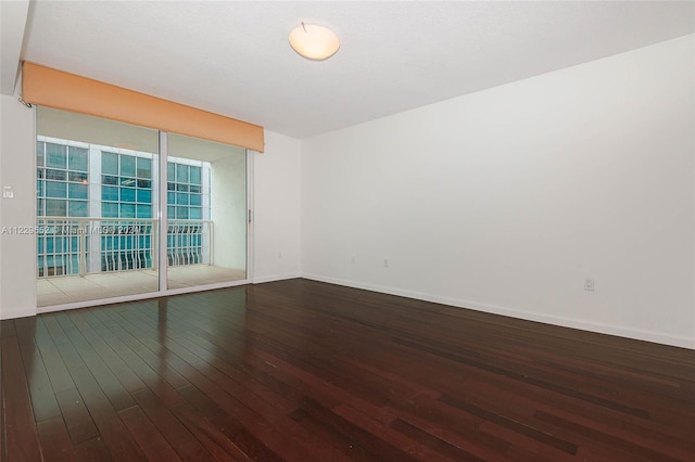 empty room featuring hardwood / wood-style flooring