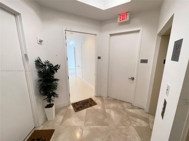 interior space featuring light tile floors