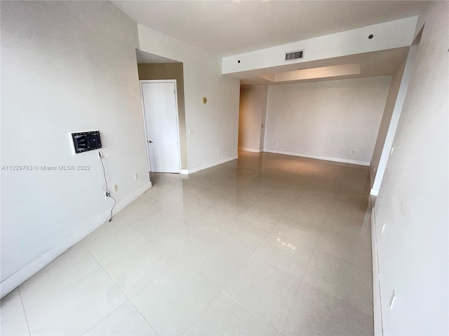 empty room featuring light tile floors