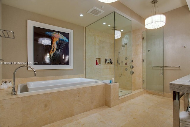 bathroom with plus walk in shower and tile flooring