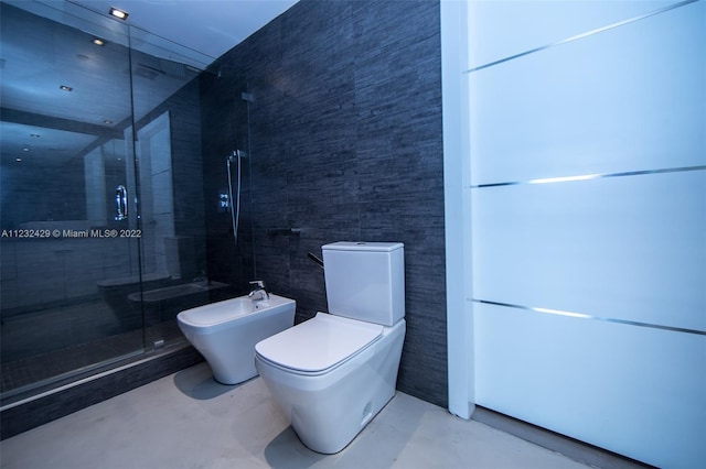 bathroom with a bidet, concrete floors, a shower with shower door, and toilet