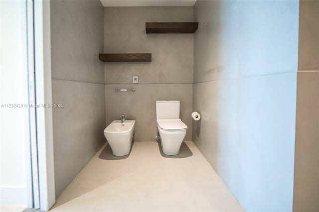 bathroom featuring a bidet and toilet