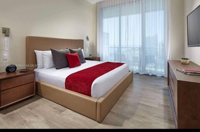 bedroom featuring light wood-type flooring