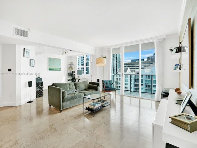 tiled living room with a wall of windows and crown molding