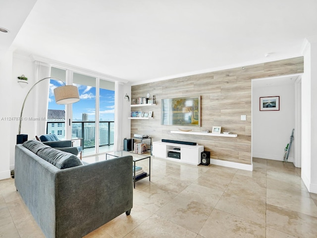 tiled living room featuring expansive windows