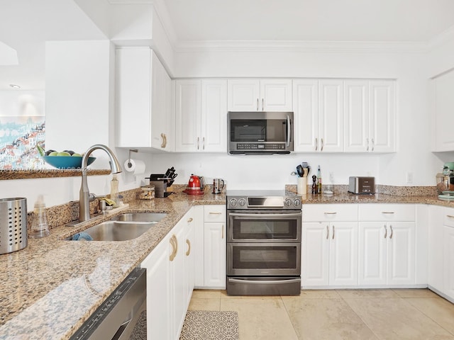 kitchen featuring crown molding, stainless steel appliances, white cabinets, and sink