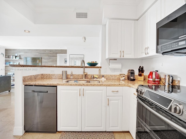 kitchen featuring white cabinets, light stone countertops, sink, and stainless steel appliances