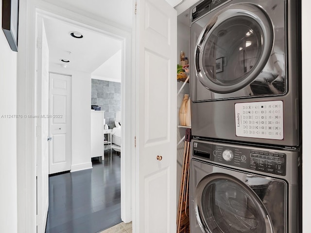 washroom with stacked washer and clothes dryer