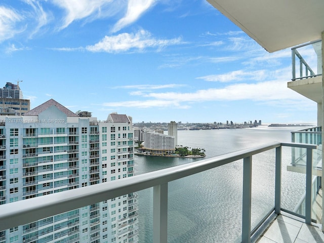 balcony featuring a water view