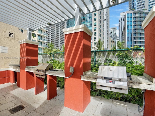 view of patio / terrace with a balcony and a pergola