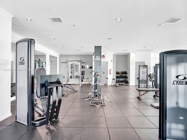 workout area featuring tile floors