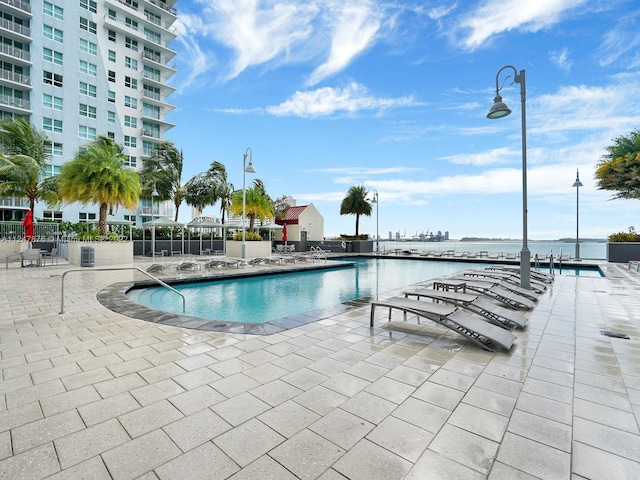 view of swimming pool with a patio