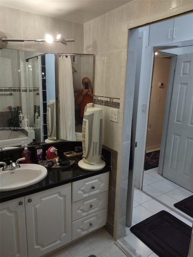 bathroom with tile flooring, oversized vanity, and tile walls