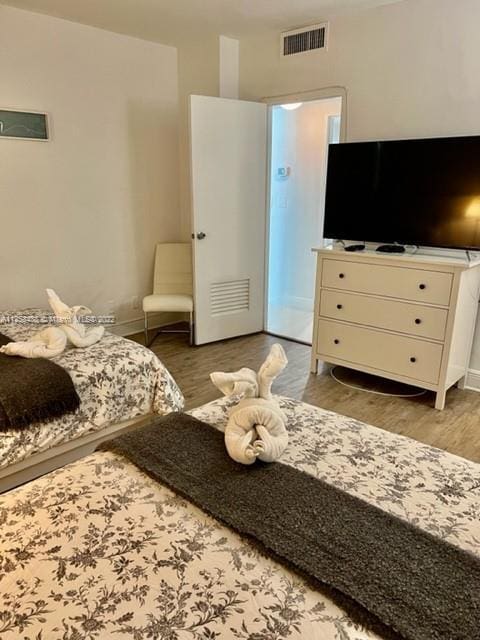 bedroom featuring light wood-type flooring