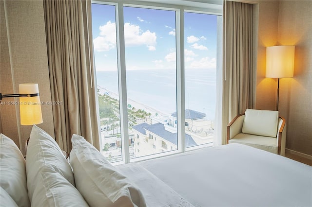 bedroom featuring a water view