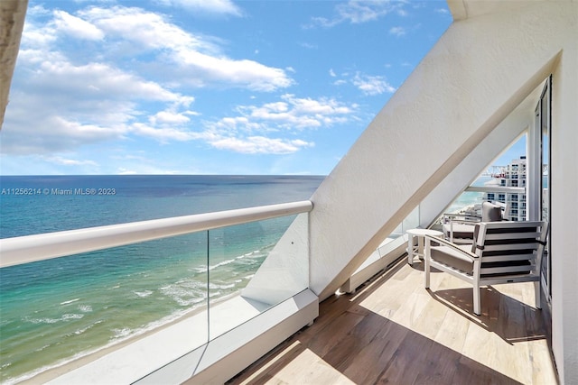 balcony featuring a water view