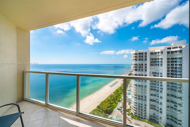 balcony with a view of the beach and a water view