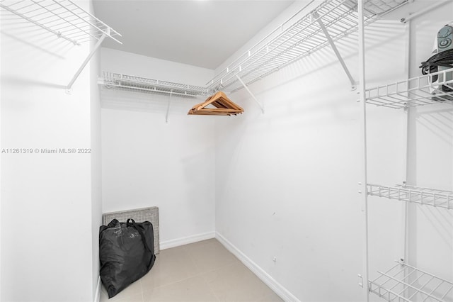 walk in closet featuring tile patterned floors