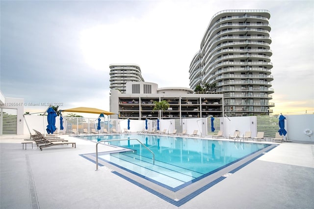 view of swimming pool with a patio