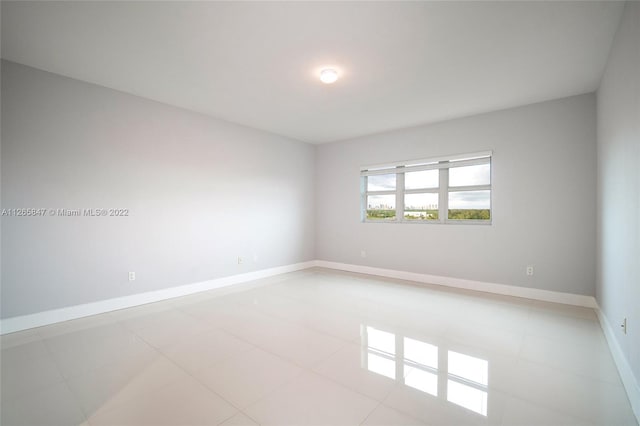 empty room with light tile floors