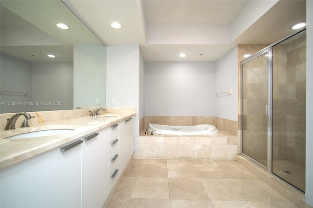 bathroom featuring double sink vanity, plus walk in shower, and tile flooring