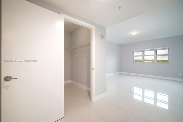 interior space featuring light tile floors