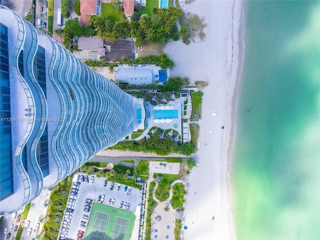 aerial view featuring a water view and a beach view