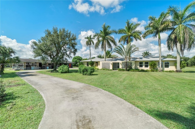 ranch-style house featuring a front yard