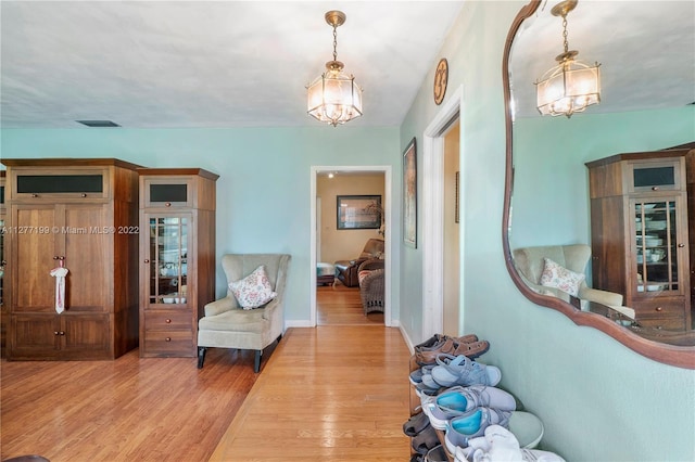 hallway featuring light hardwood / wood-style flooring