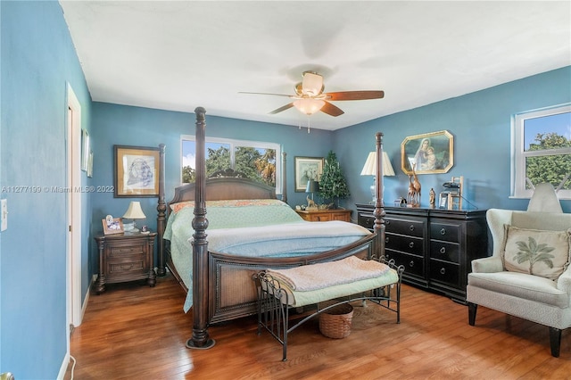 bedroom featuring dark hardwood / wood-style flooring and ceiling fan