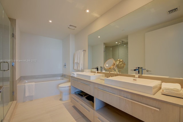 full bathroom featuring double sink, plus walk in shower, tile flooring, toilet, and large vanity