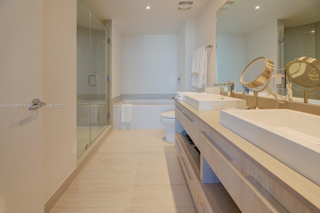 full bathroom with tile floors, toilet, independent shower and bath, and double sink vanity