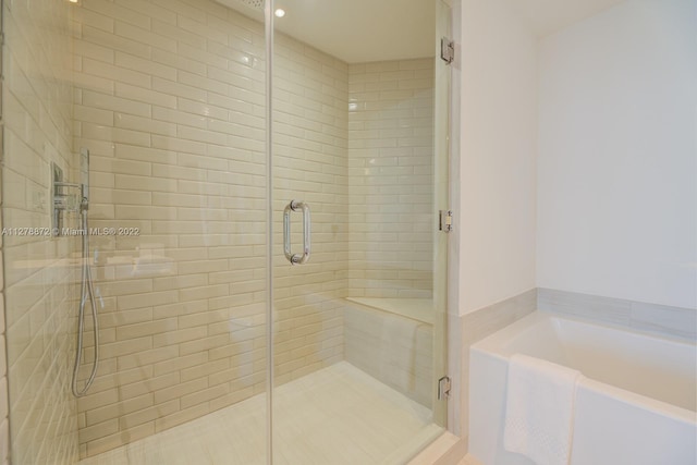 bathroom featuring plus walk in shower