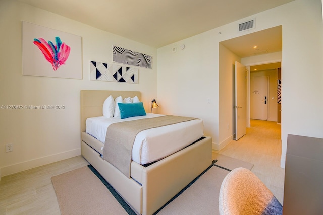 bedroom featuring light hardwood / wood-style floors